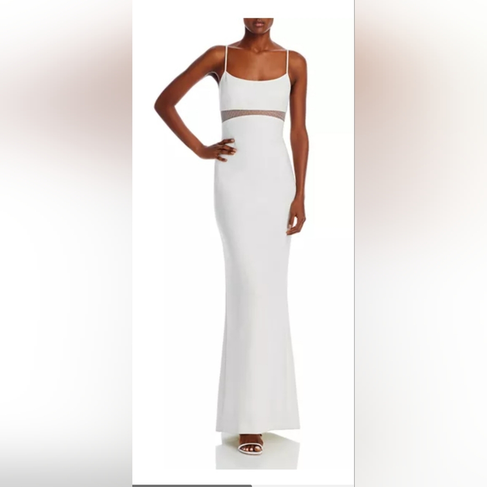 Likely white long dress with small train